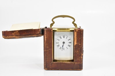 Lot 2185 - A French brass cased oval carriage clock, with...