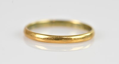 Lot 2602 - A yellow metal wedding band, size U,...