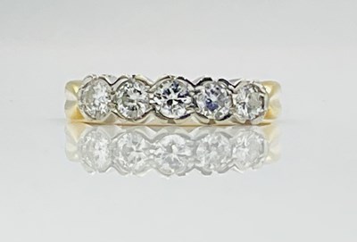 Lot 654 - An 18ct yellow gold white metal tipped five...