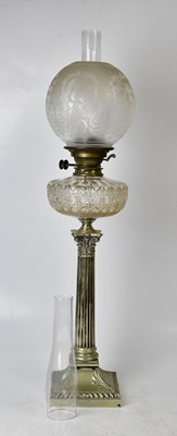 Lot 65 - A silver-plated oil lamp with a Corinthian...