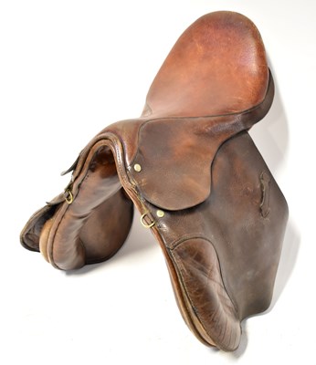 Lot 242 - A vintage leather horse saddle with brass...