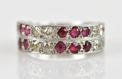 Lot 2319 - A white metal diamond and ruby double row...