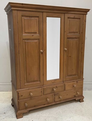 Lot 62 - A modern pine wardrobe, with mirror, two doors...