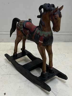 Lot 1408 - A modern painted pine rocking horse, height...