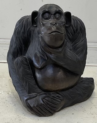 Lot 2199 - A modern carved hardwood model of a seated...