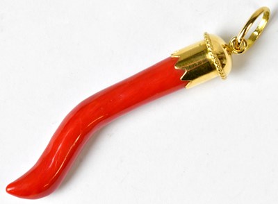 Lot 926 - An 18ct gold mounted coral pendant of...