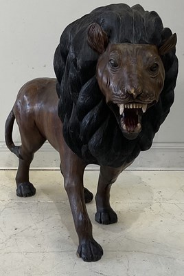 Lot 2202 - A modern carved and stained hardwood model of...