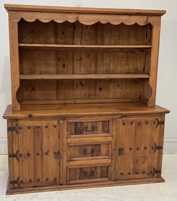 Lot 65 - A modern pine dresser, with raised open...