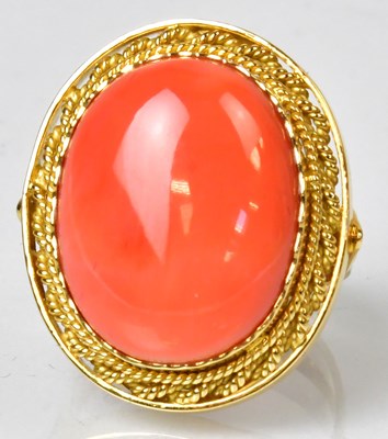Lot 810 - An 18ct gold cocktail ring set with an oval...