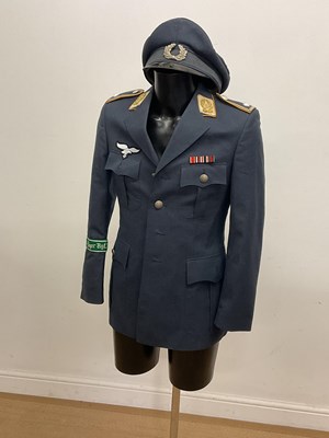 Lot 104 - East German flight captains  tunic and hat; a...