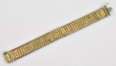 Lot 1157 - A 9ct yellow gold flexi link bracelet with...