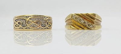 Lot 669 - Two 9ct yellow gold large rings, sizes U and V...