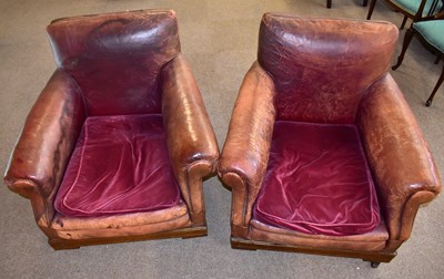 Lot 1643 - A pair of leather armchairs
