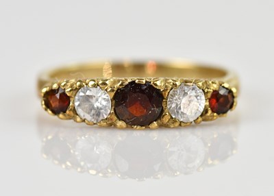 Lot 2543 - A 9ct yellow gold garnet set dress ring, set...