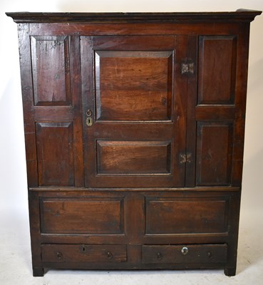Lot 1681 - A Georgian oak livery cupboard