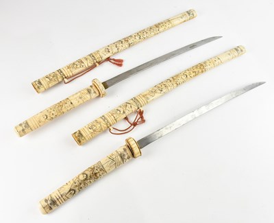 Lot 475 - Two early 20th century Japanese carved bone...