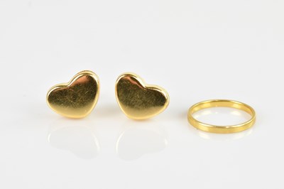 Lot 2546 - An 18ct yellow gold wedding band, size K, and...