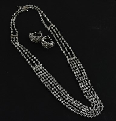Lot 2001 - A white metal four strand diamond set necklace,...