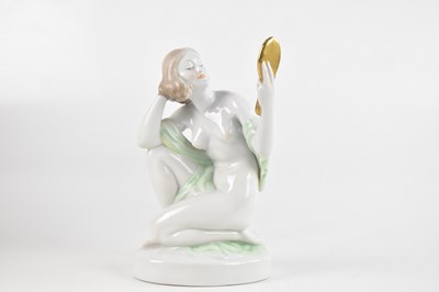 Lot 1295 - HEREND; a porcelain model of a scantily clad...