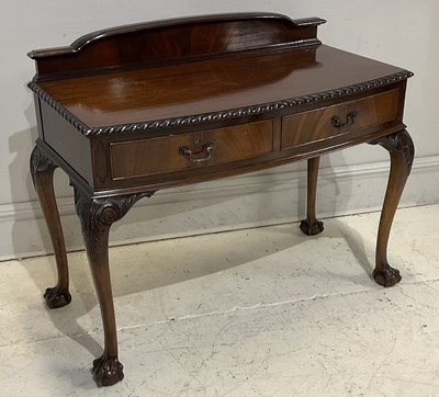 Lot 2128 - A 1950s mahogany serving table, with raised...