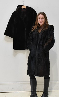 Lot 279 - A dark brown mink fur coat made up of pelts,...