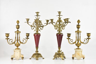 Lot 2409 - Four decorative candelabra including a pair of...