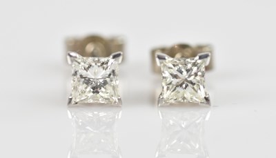 Lot 1358 - A pair of 18ct white gold diamond set earstuds,...