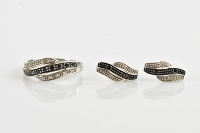 Lot 662 - A 9ct white gold sapphire and diamond ring,...