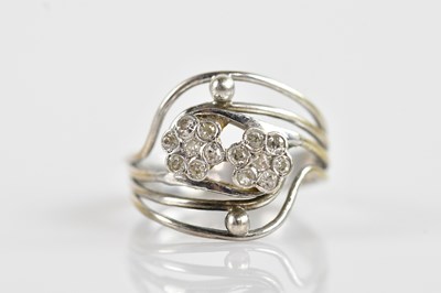 Lot 381 - A silver and diamond set double flower head...