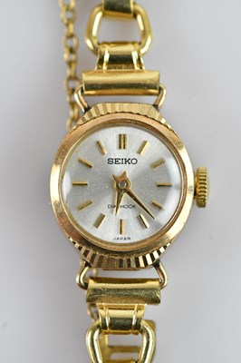Lot 705 - SEIKO; a lady’s 9ct gold wristwatch, stamped...