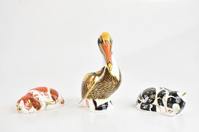 Lot 1345 - ROYAL CROWN DERBY; three paperweights,...
