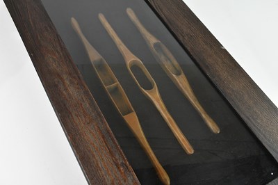 Lot 2241 - Three 19th century treen weaving shuttles, in...