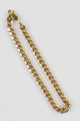 Lot 1172 - A yellow metal flat curb link bracelet,...