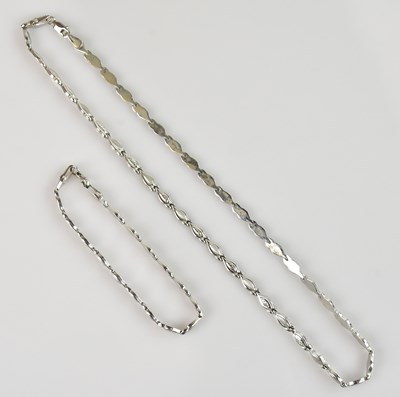 Lot 2080 - A white metal necklace and matching bracelet,...