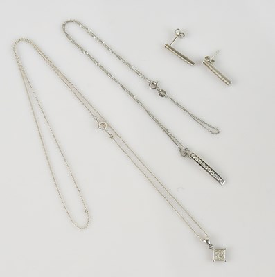Lot 2148 - A white metal and colourless stone set pendant,...
