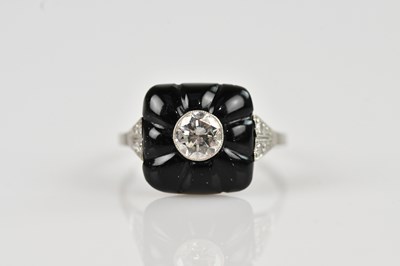 Lot 2259 - An Art Deco white metal diamond set dress ring,...