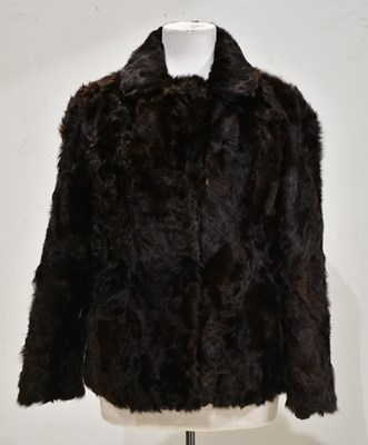 Lot 327 - A vintage curly chestnut dark brown rabbit fur...