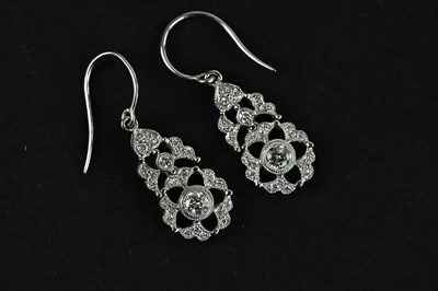 Lot 1365 - A pair of white metal diamond set articulated...