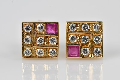 Lot 1377 - A pair of diamond and ruby set ear studs, set...