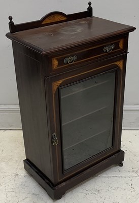 Lot 2084 - An Edwardian inlaid music cabinet with drawer...