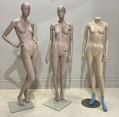 Lot 1228 - Three plastic fashion mannequins, all female,...