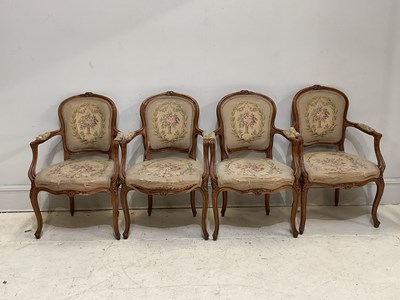 Lot 90 - A set of four French Louis XV style walnut...