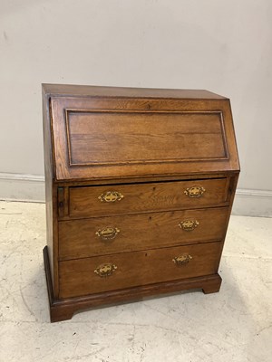 Lot 2121 - An early 20th century oak bureau with three...