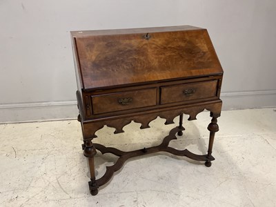 Lot 2122 - WOLFF & ALEXANDER; a reproduction walnut music...