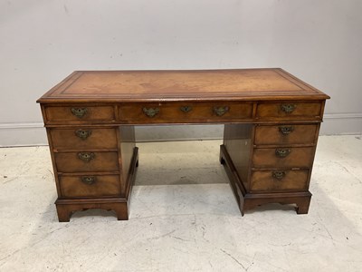 Lot 2138 - A reproduction nine drawer pedestal desk with...