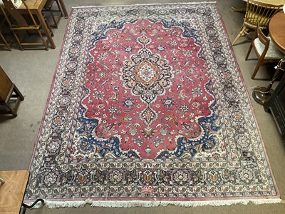 Lot 2160 - A large hand knotted Persian woollen carpet 3m...