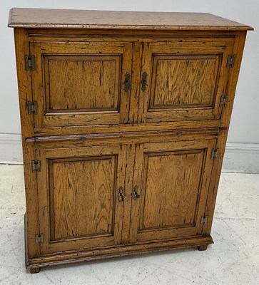 Lot 33 - CUMPERS; a reproduction oak cocktail cabinet,...