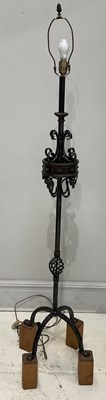 Lot 1385 - A modern wrought iron and brass standard lamp,...
