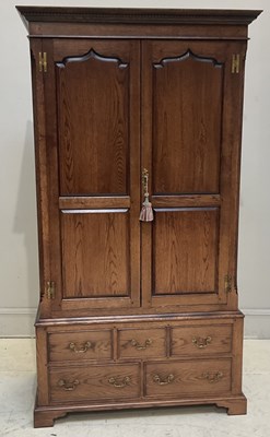 Lot 14 - A reproduction oak livery cupboard, height...