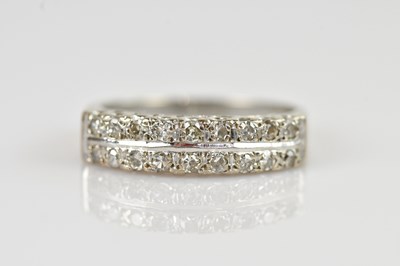 Lot 2383 - An 18ct white gold diamond set dress ring, set...